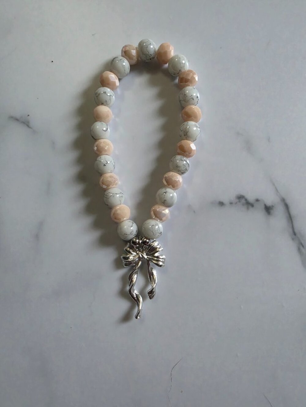 2 Pink and Marble Beaded Bracelets with Silver Bow